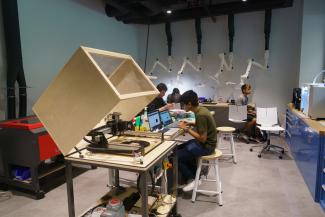 Color photograph of a student working in a lab.